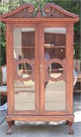 CARVED INDONESIAN WOODEN AND GLASS BOOKCASE