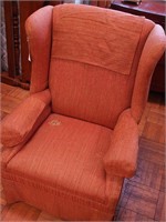 Upholstered high wingback armchair