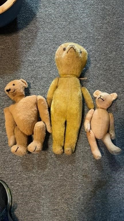 Three teddy bears, two antique bears, one has all