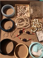Flat of costume jewelry bracelets and necklaces