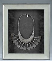 Framed Arabian Hilal silver necklace.