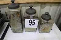 Set Of 3 Metal And Glass Containers With Contents