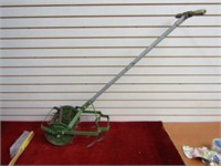 Antique green cultivator.