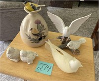 Bird figurines and birdhouse with goldfinch