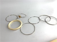 7 Bracelets: 4 are sterling silver, total weight o