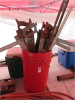 bucket of saws, levels, squares, etc