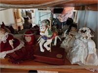 Contents of Shelf. Christmas.  Musical dolls and