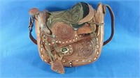 Leather saddle purse with apology