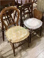 Two vintage wooden chairs with padded cushioned