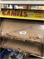 Camels cigarette display, rusted