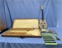 Vintage Electric Guitar and Sheet Music
