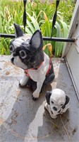 Painted concrete dog statues, largest is