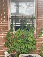 Wrought iron window panel right side back bedroom