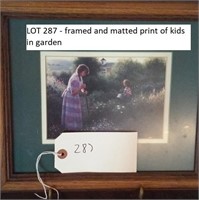 framed and matted print of kids in garden
