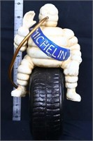 Cast iron Michelin man on tire