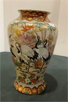 Oriental themed and painted vase with cranes