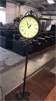 Metal clock on stand  2 sided battery operated