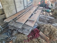 Stack of rough sawn cherry lumber all 11'  long