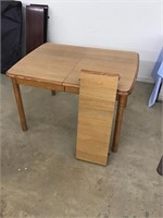 Nice solid modern dining table with leaf. 48 x 36