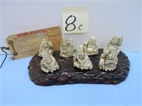 (7) Oriental Design Ivory Style Figures on Board