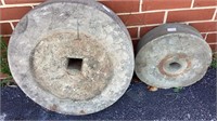 2 antique mill stones