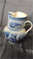 Stoneware pitcher blue flower 7in