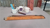 Assorted shaving straps, mugs, razors, combs