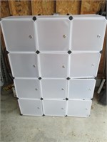 white plastic/cloth storage unit