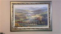 Large framed canvas of hillside