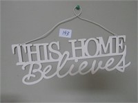 "This Home Believes" sign