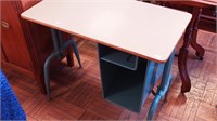 A metal desk with Formica top, 32 1/2" high x
