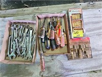 flat of wrenches, screw drivers, router bit set