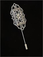 Floral silver colored stick brooch