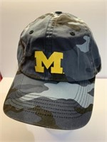 M camouflage Velcro, adjusting ball cap, appears