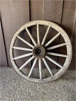Antique wooden and iron wagon wheel.  42”