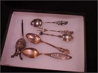 Three sterling silver utensils: a spoon and fork