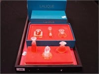 Two boxes of Lalique miniature perfumes in