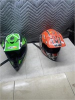 Pair of helmets - green one is youth large, orange