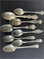 Eight. Sterling silver spoons.