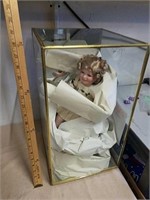 Collectible porcelain doll in display box