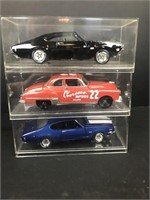 Three collectible metal diecast cars 1/18 scale