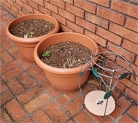 Pair of flower pots and a plant stand