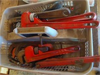 tote with pipe wrenches and misc tool