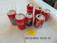 Group of  7 Mini Coca-Cola Cans