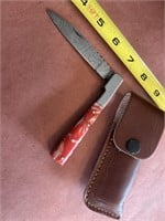 Damascus steel pocket knife with leather case