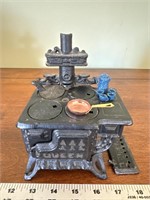 Vintage miniature queen cast-iron cookstove with