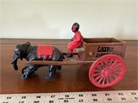 Vintage cast iron elephant on a bicycle pulling a