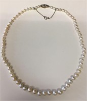 GIA CERTIFIED STAND OF 59 GRADUATED NATURAL PEARLS