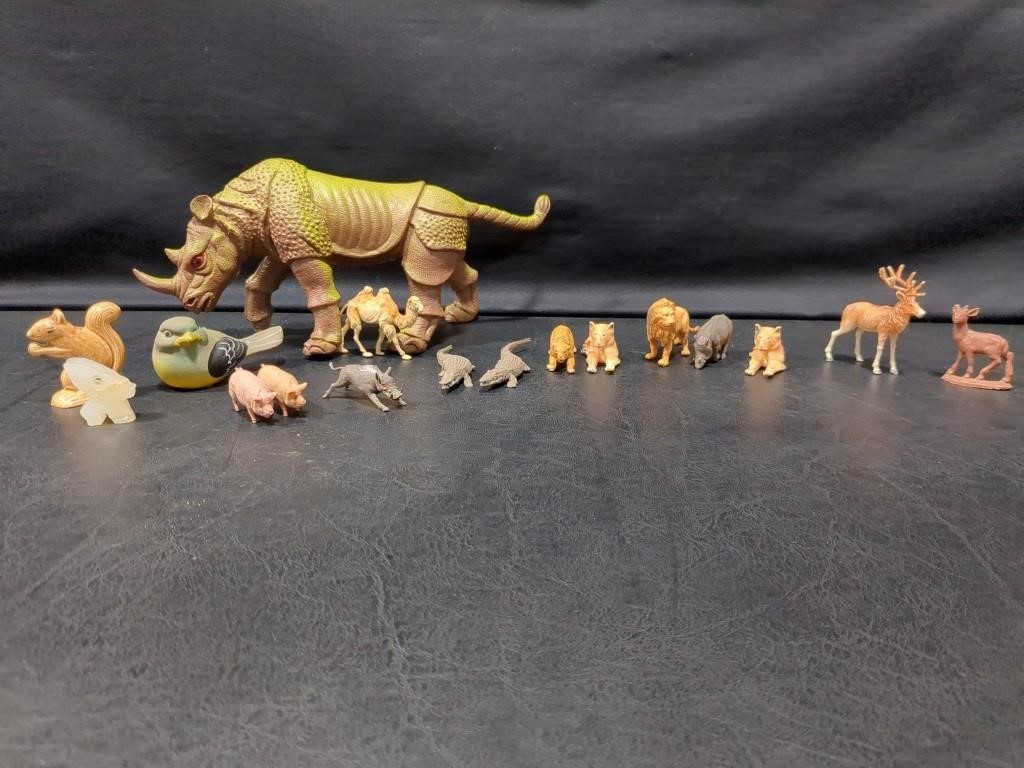Miniature plastic animals, dinosaur, motorbike,