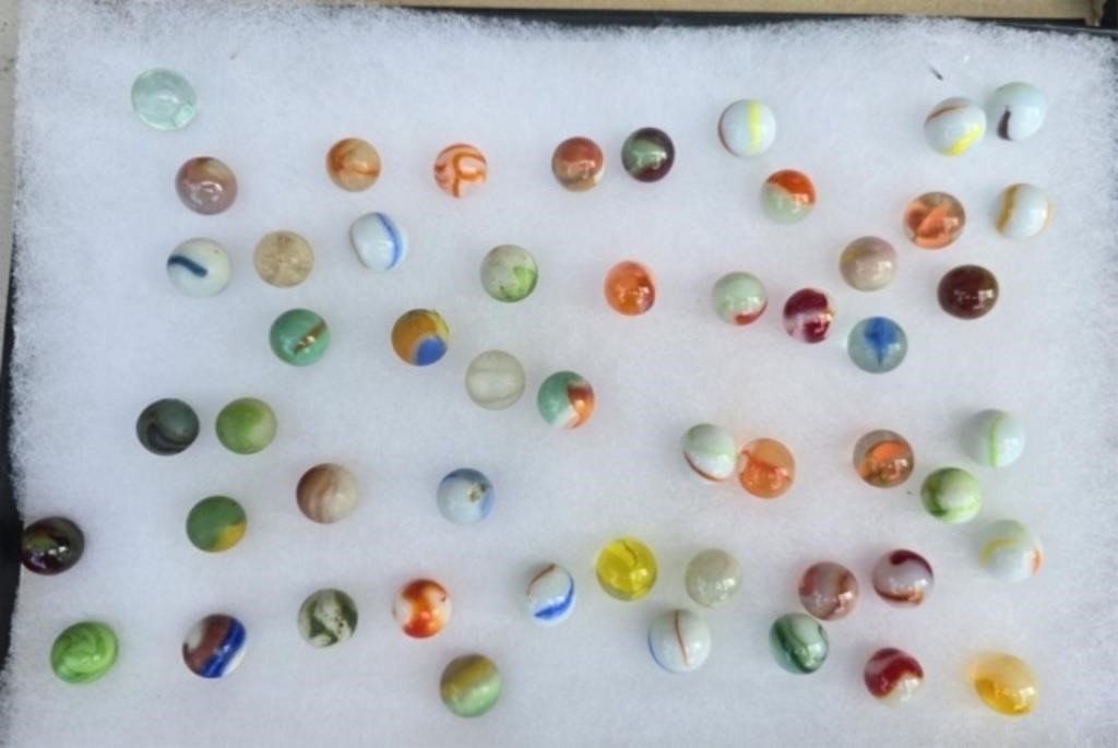 Display case of glass marbles